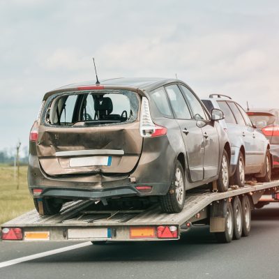 car-trailer-is-being-towed-by-tow-truck-scaled.jpg